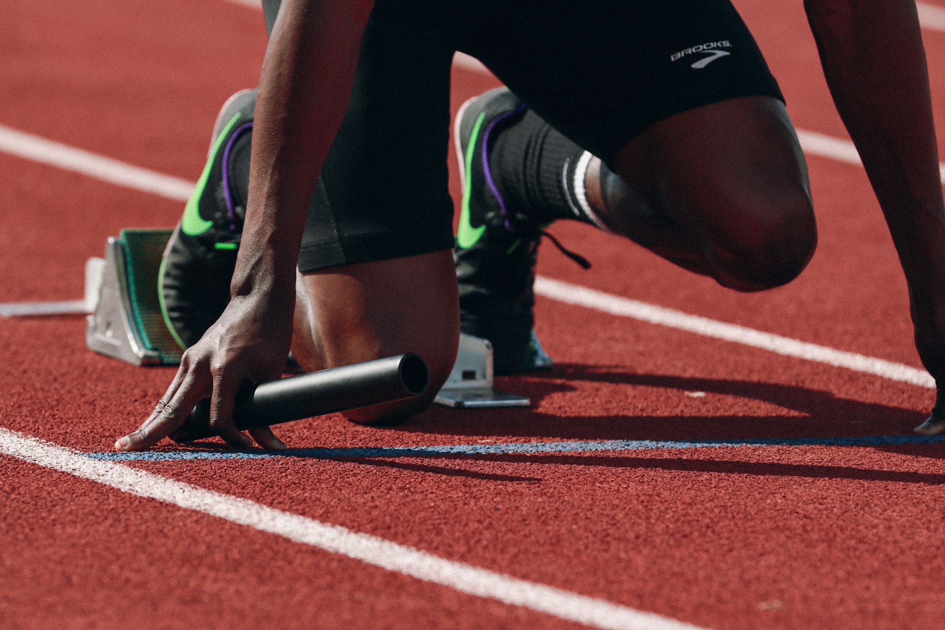 Runner in full stride on a track